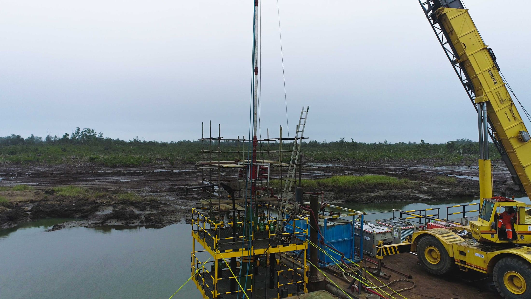Mobile crane positioned over a wellhead platform ahead of intervention