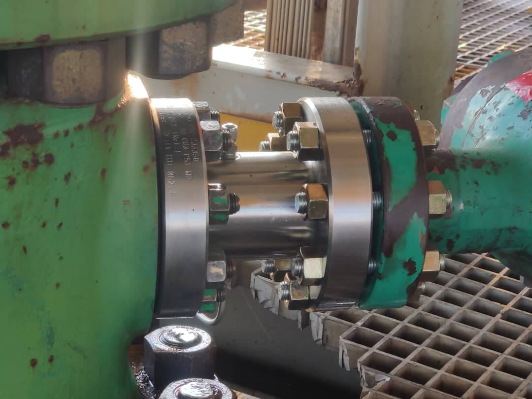 Close-up of a precision flange connection on wellhead equipment