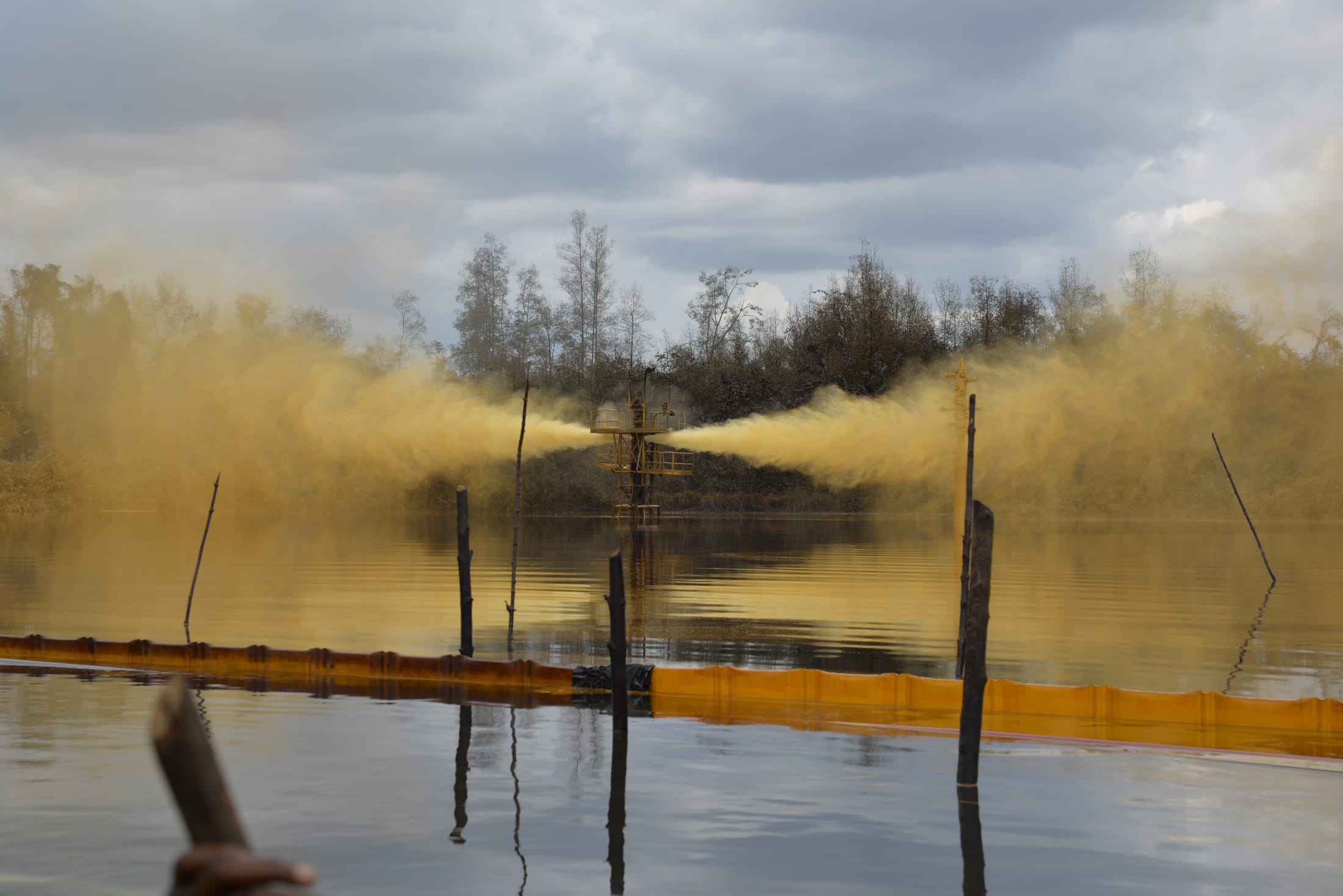 Response crew and crane staged on a wellhead platform during containment operations